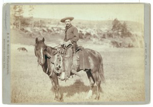 vintage sepia photo of a cowboy on a horse